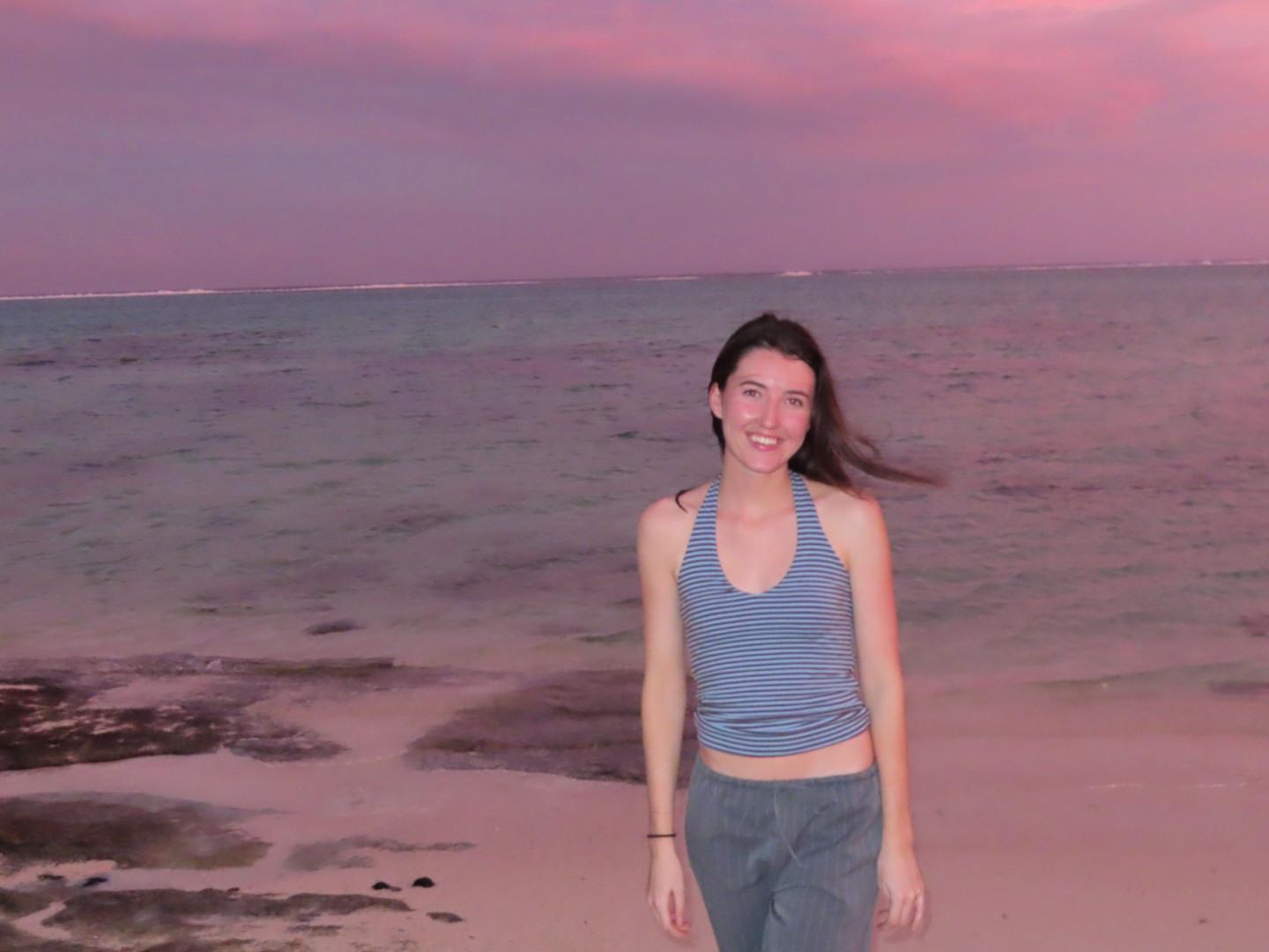 Megan, founder of BY MANLY, on the beach at sunset